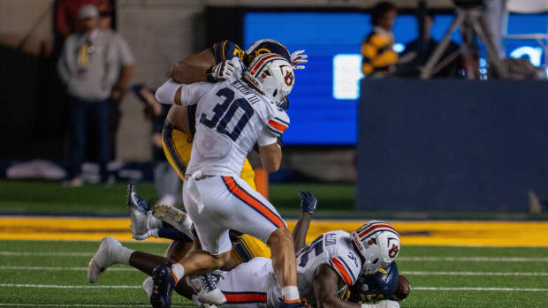 Sep 9, 2023; Berkeley, California, USA; California Golden Bears running back Isaiah Ifanse (22) fumbles the football recovered by Auburn Tigers linebacker Jalen McLeod (35) during the second quarter at California Memorial Stadium. Mandatory Credit: Neville E. Guard-USA TODAY Sports  